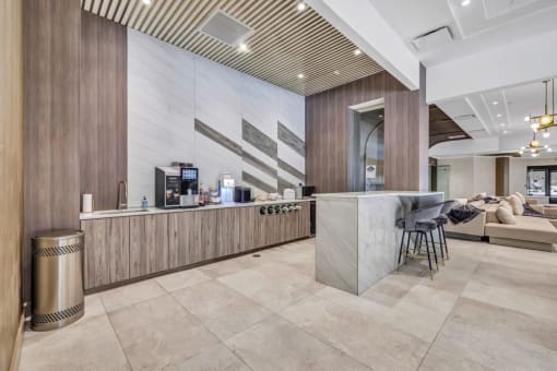 a lobby with a bar and a couch at Up House, Farmington, CT