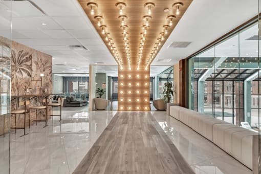 a large lobby with a row of lights on the ceiling at Up House, Farmington, 06032