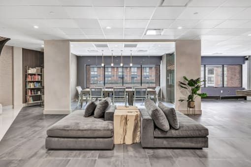 a lobby of an office building with couches and a table at Up House, Farmington, CT, 06032