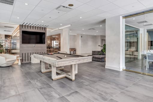 a game room with a pool table and a tv at Up House, Connecticut, 06032