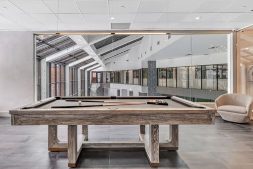 a billiards table in the lobby of an office building at Up House, Farmington, 06032