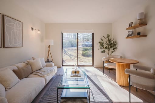 a living room with a couch and a glass table at Up House, Connecticut, 06032