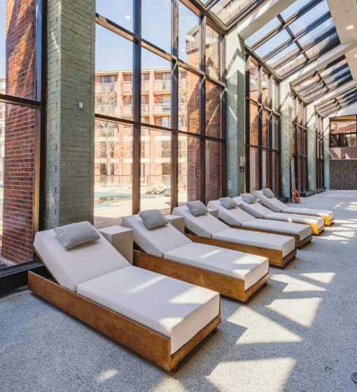 a row of beds in a lobby of a building at Up House, Farmington, CT, 06032
