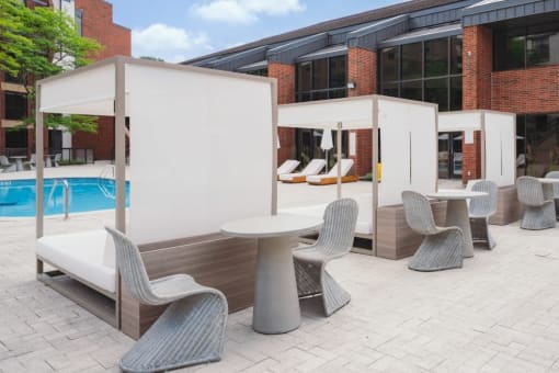 a patio with tables and chairs and a pool at Up House, Farmington, Connecticut