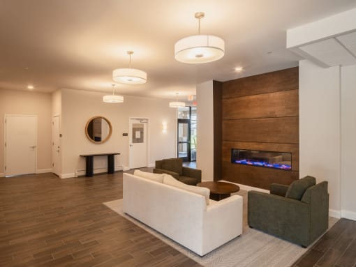 a living room with a couch and a fireplace
