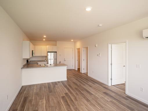 A kitchen with a countertop and cabinets is shown in this image.