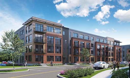 A modern apartment complex with a mix of brick and panel exterior walls.