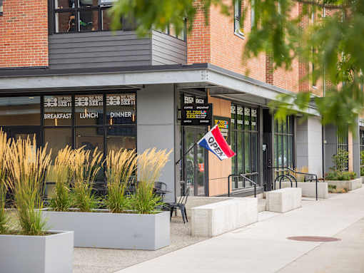 A restaurant with a sign that says "Breakfast Lunch Dinner" is shown.