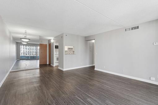 A room with wooden floors and white walls.