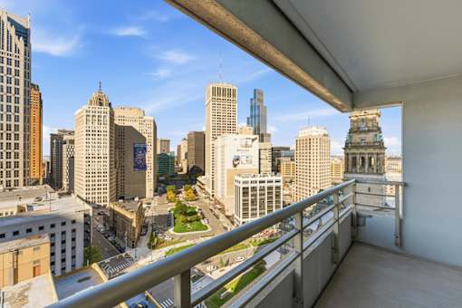 A cityscape viewed from a balcony.