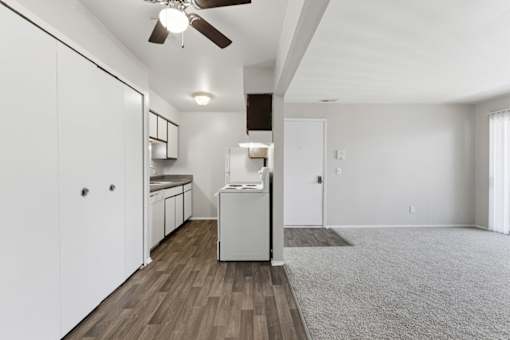 A white laundry room with a washer and dryer.