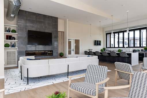 A modern living room with a fireplace and a white sofa.