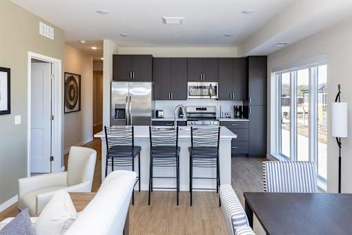A modern kitchen with a white and black color scheme.