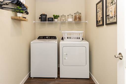 A laundry room with a washer and dryer.
