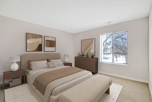 A bedroom with a large bed and two lamps on side tables.