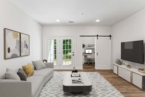 A modern living room with a grey sofa and a coffee table.