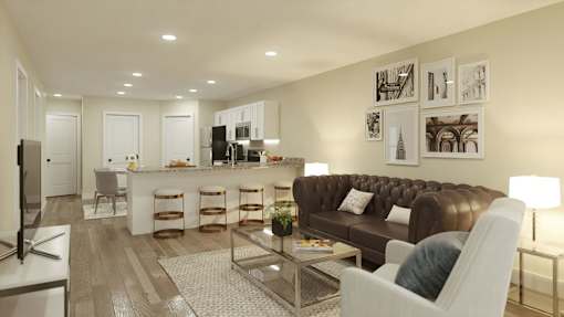 A modern living room with a brown leather couch and a television.