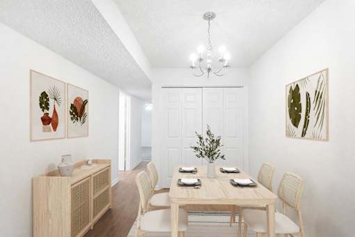 A dining room with a wooden table set for four.