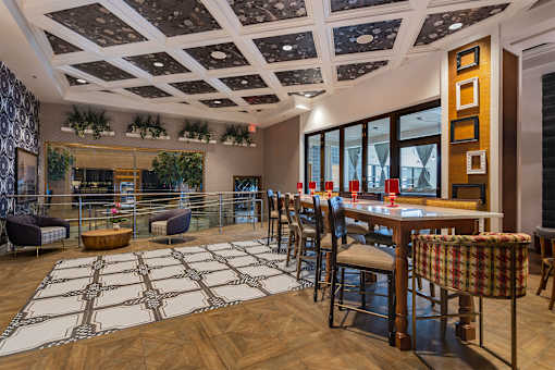 A dining room with a wooden table and chairs.