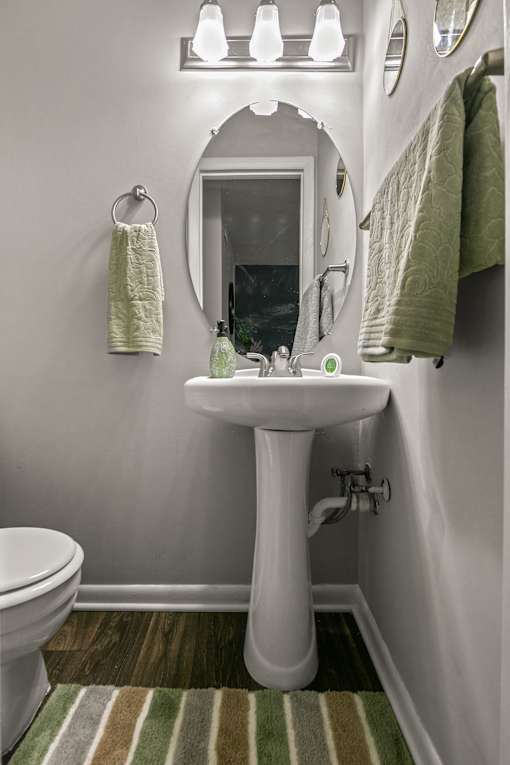 a small bathroom with a sink and a mirror