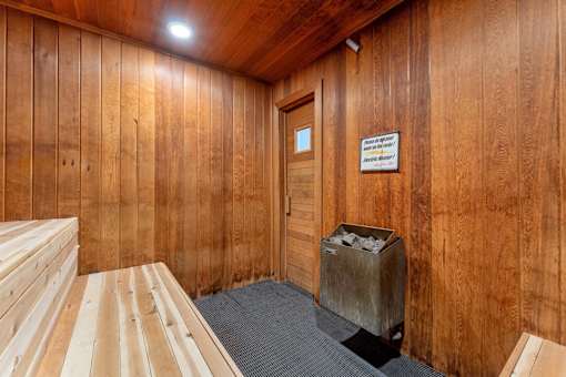 A room with wooden walls and a door.