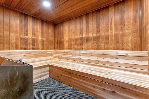 A room with wooden walls and a bench.