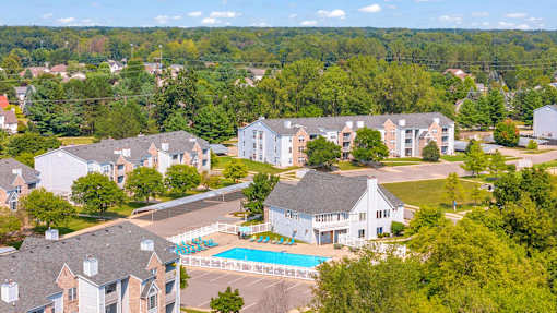 A bird's eye view of a resort with a swimming pool.