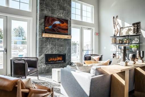 a living room with a couch and a fireplace