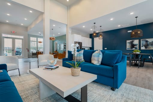 community clubhouse with blue sofas and large coffee table
