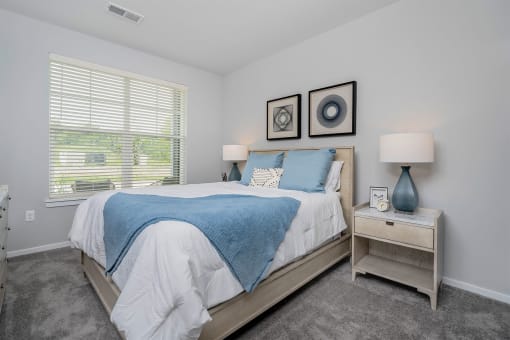 a bedroom with a bed and a window