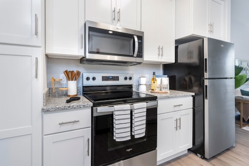 a kitchen with a stove and a microwave