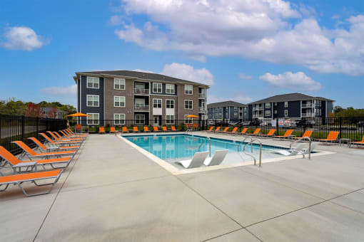 our apartments feature a swimming pool with lounge chairs