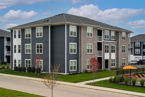 an apartment building on the side of a street
