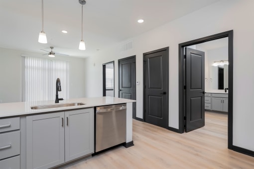 a kitchen with a sink and a counter top