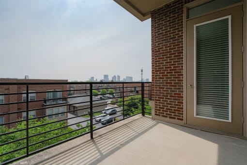 a balcony with a view of the city