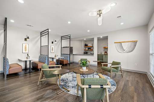 A modern dining room with a round table and chairs.