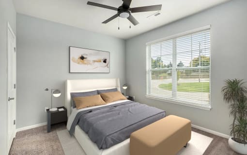 a bedroom with a bed and a ceiling fan
