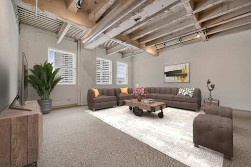 A living room with a brown couch and a wooden cabinet.