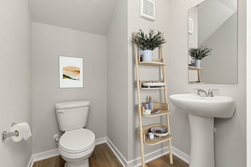 A white toilet sits next to a white sink with a wooden shelf above it.
