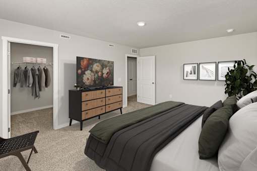 A bedroom with a bed, dresser, and a wall with pictures.