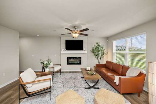 A living room with a fireplace and a television.