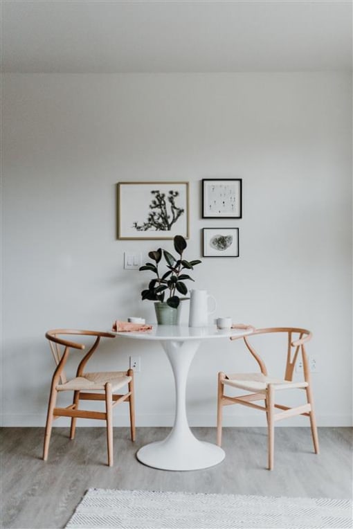 a table and two chairs in a room