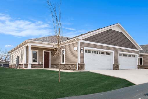 A two-car garage is attached to a house.