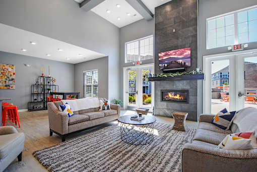 a living room with couches and a fireplace