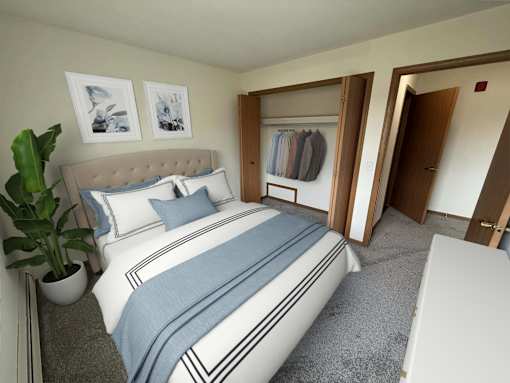A bedroom with a bed, a plant, and a coat rack.