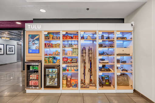 A Tulu vending machine with many items inside.