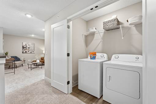 A laundry room with a washer and dryer.