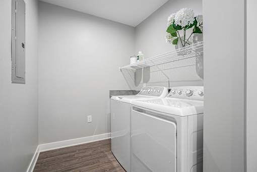 A laundry room with a washer and dryer.