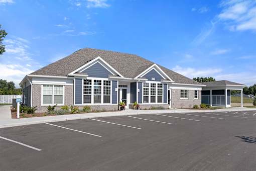 A building with a parking lot in front of it.