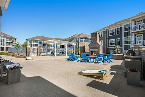 A sunny day at the outdoor pool area of a residential complex.